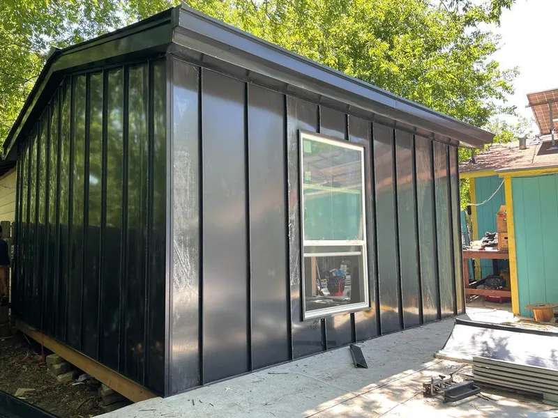 Black standing seam metal wall panels for Metal Roof Installation in Iola