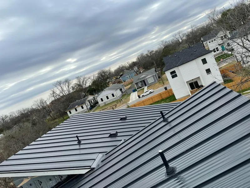 Standing seam metal roof panels with vents for Skylight Repair in Iola